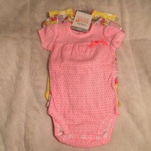 Brand new set of 3 month baby girl onesies.